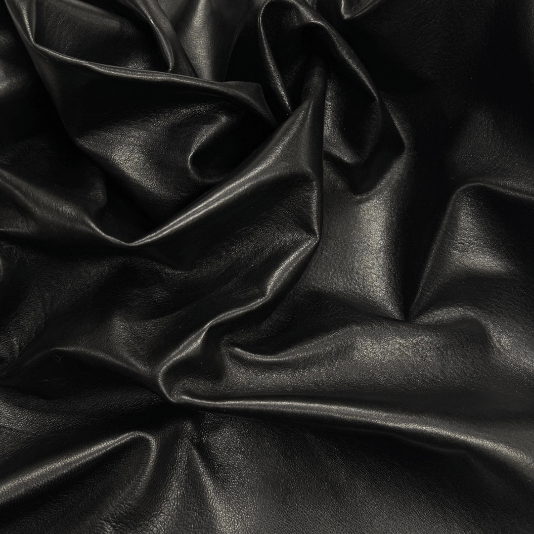 Elegant satin lamb leather material used for luxury product packaging.